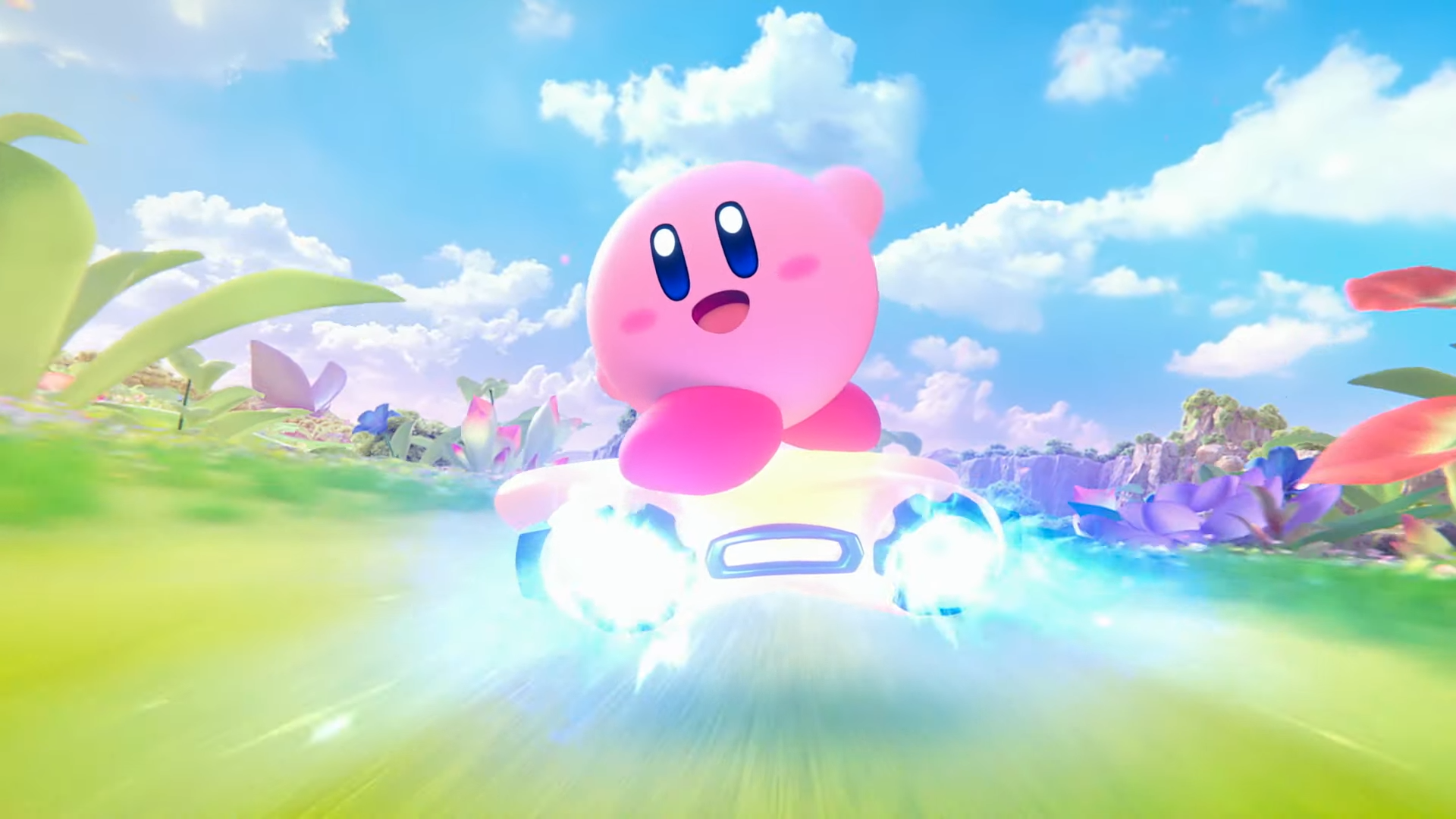 Kirby the pink ball with a face riding a star in a colourful landscape in Kirby Air Riders screenshot