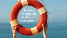 A person holding a life ring with the text 'Trouble Managing Feelings of Overwhelm?' on it, against a serene ocean background.