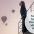 A woman standing on a balcony, looking thoughtfully into the distance, with colorful hot air balloons floating in the sky. Text overlay asks, 'Not Sure Your New Dreams Will Make You Happy?'